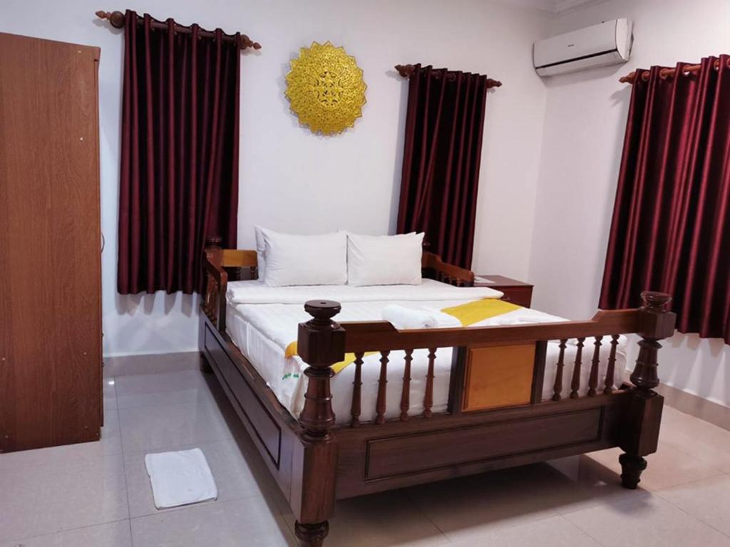 Postel nebo postele na pokoji v ubytování Hello Cambodia Boutique