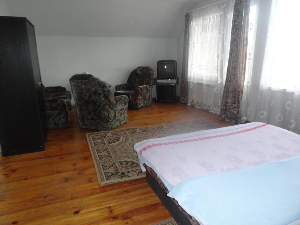 Postel nebo postele na pokoji v ubytování Hotel Rebir