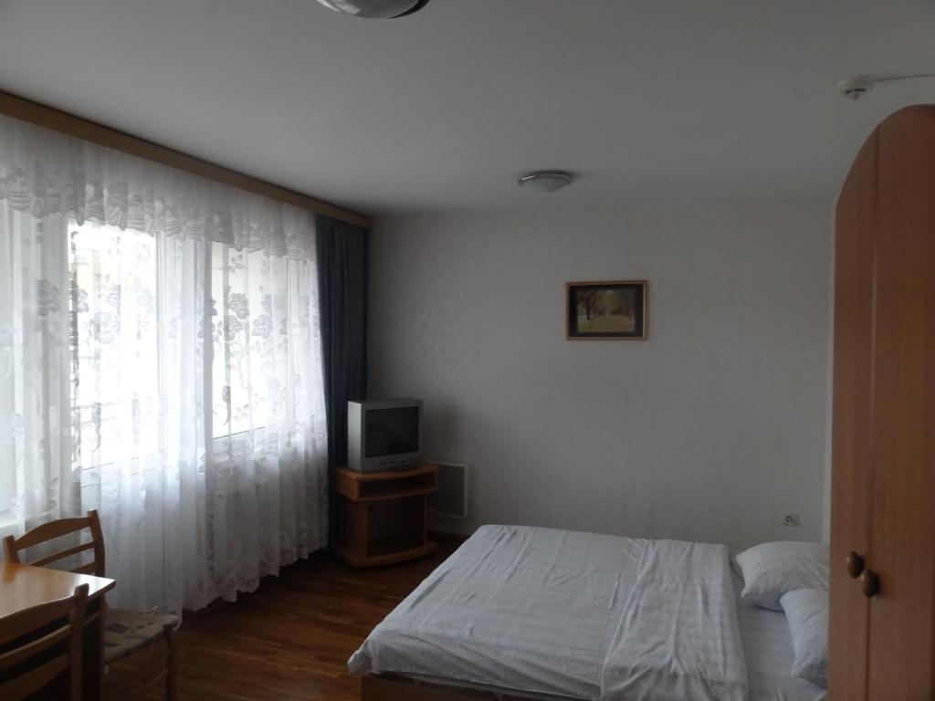 Postel nebo postele na pokoji v ubytování Hotel Rebir