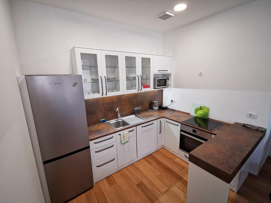 Kuchyň nebo kuchyňský kout v ubytování Argo Apartments