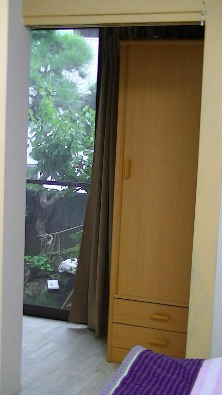 Postel nebo postele na pokoji v ubytování Minshuku Chatamago