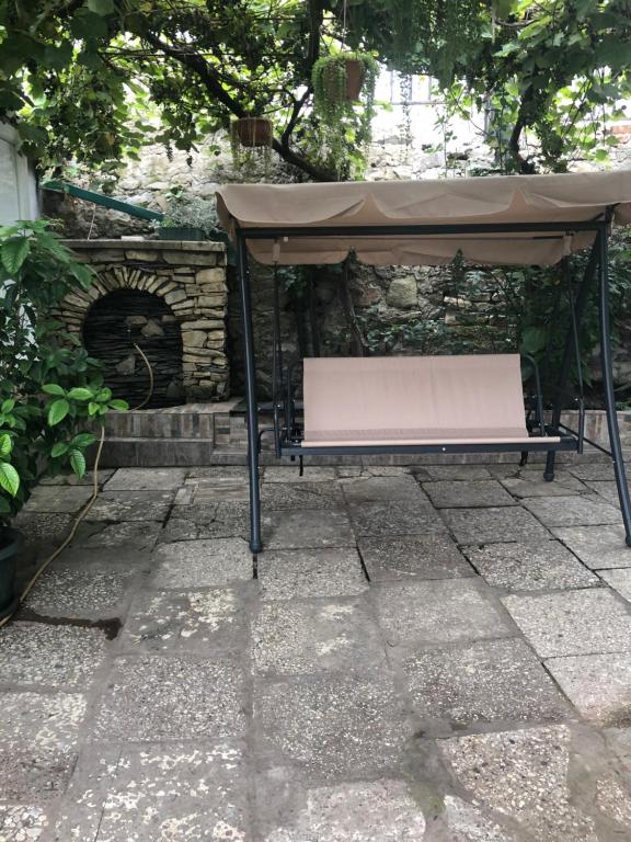a picnic table with a tent on a patio at Apartment Lui in Tbilisi City