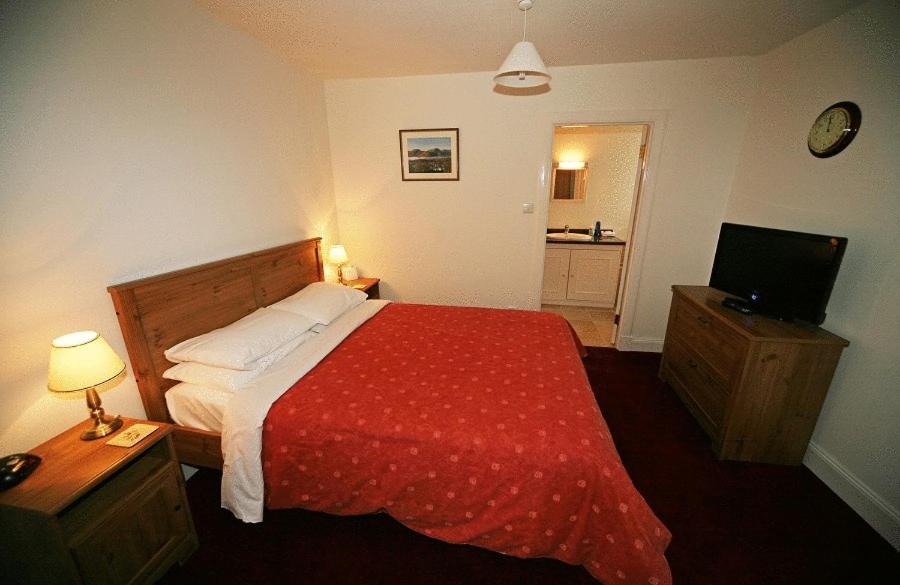 Postel nebo postele na pokoji v ubytování Balmoral Hotel