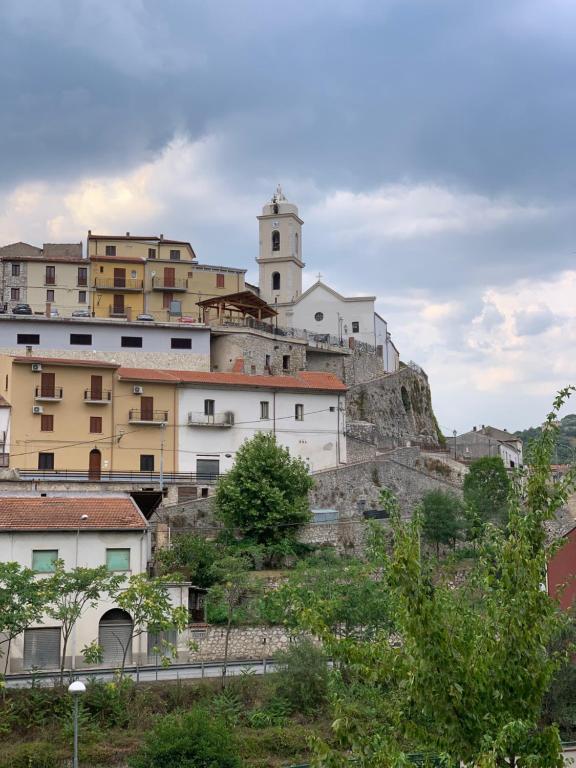 a town on top of a hill with buildings at Vista sul Lete in Pratella