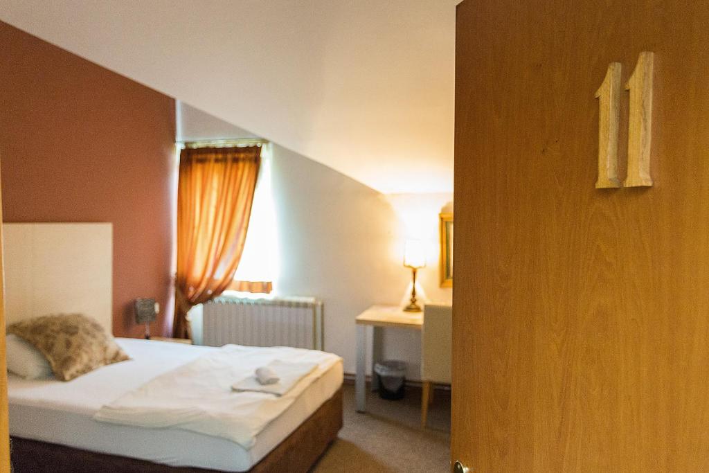 Postel nebo postele na pokoji v ubytování Hotel Dominus
