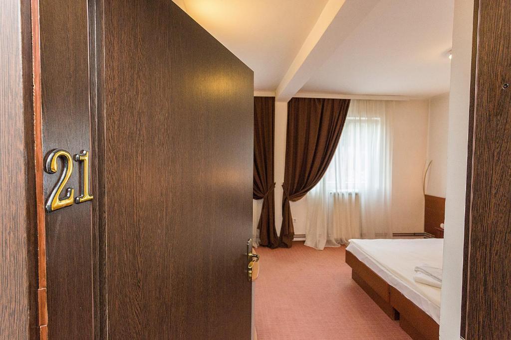 Postel nebo postele na pokoji v ubytování Hotel Dominus