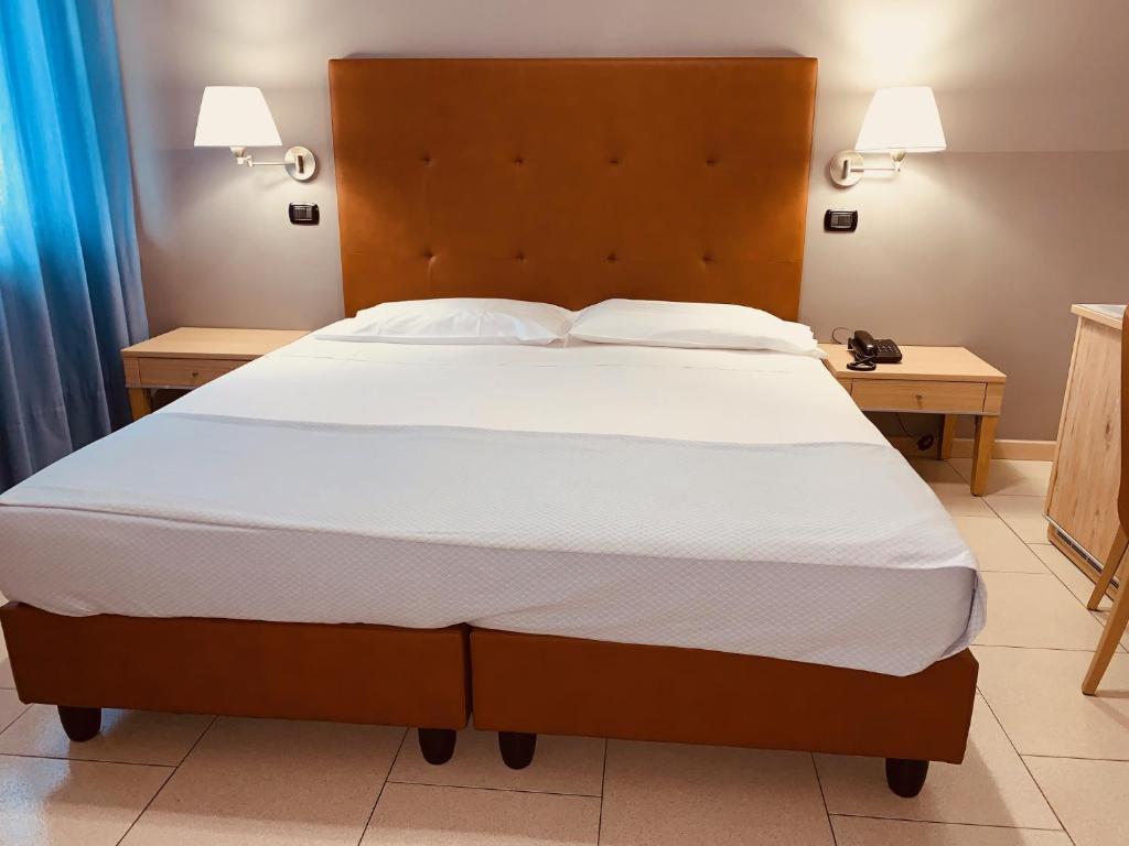 Postel nebo postele na pokoji v ubytování Flying Hotel