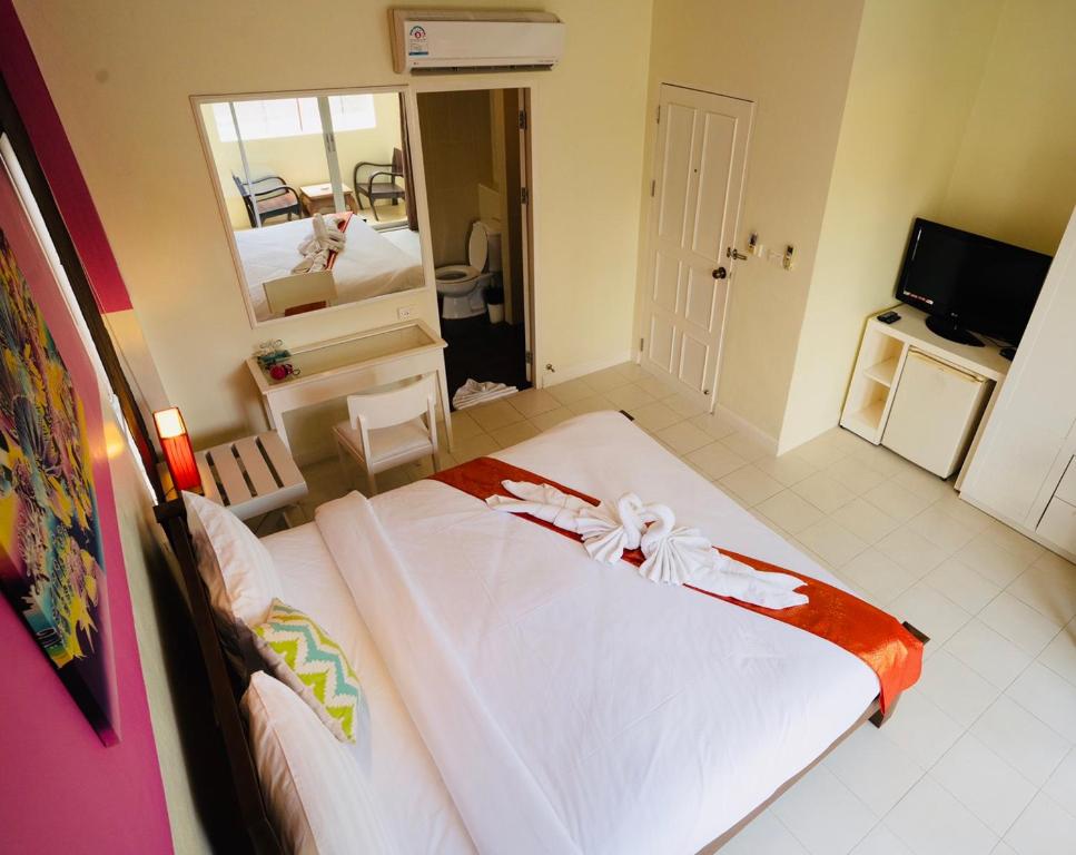 Postel nebo postele na pokoji v ubytování OK Phuket