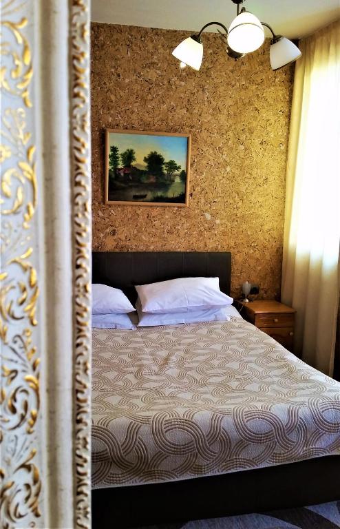 Postel nebo postele na pokoji v ubytování Family Hotel Sonata