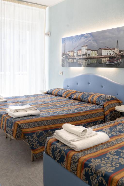Postel nebo postele na pokoji v ubytování Hotel Tiglio