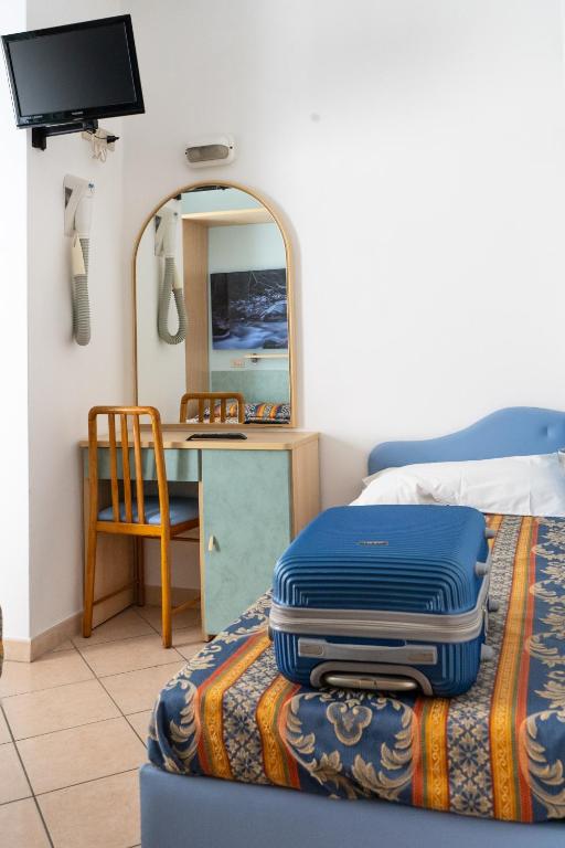 Postel nebo postele na pokoji v ubytování Hotel Tiglio