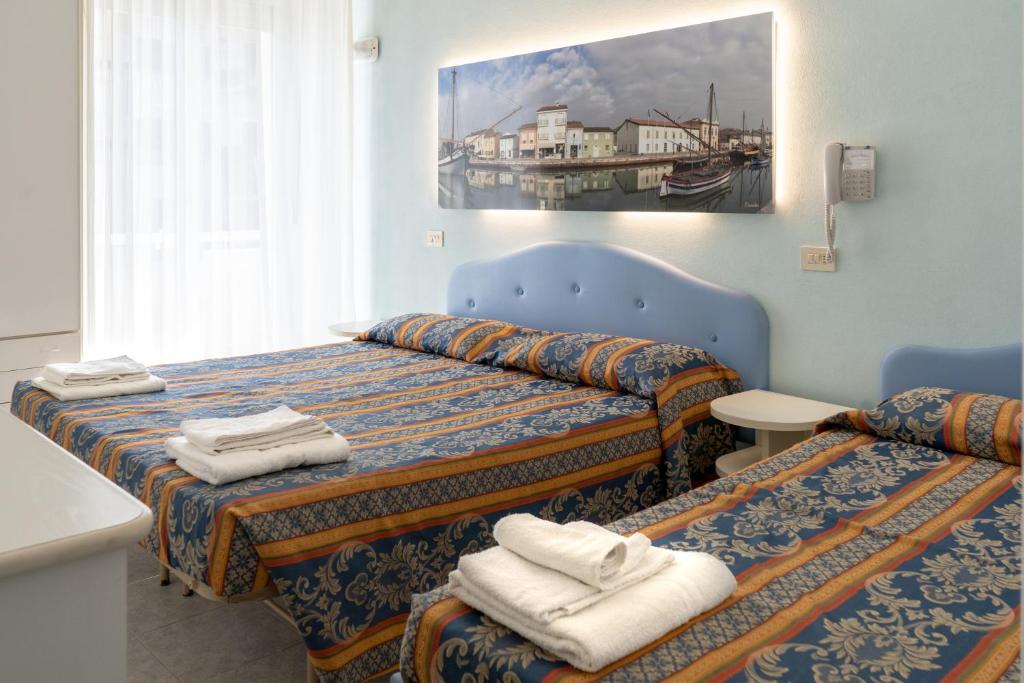 Postel nebo postele na pokoji v ubytování Hotel Tiglio