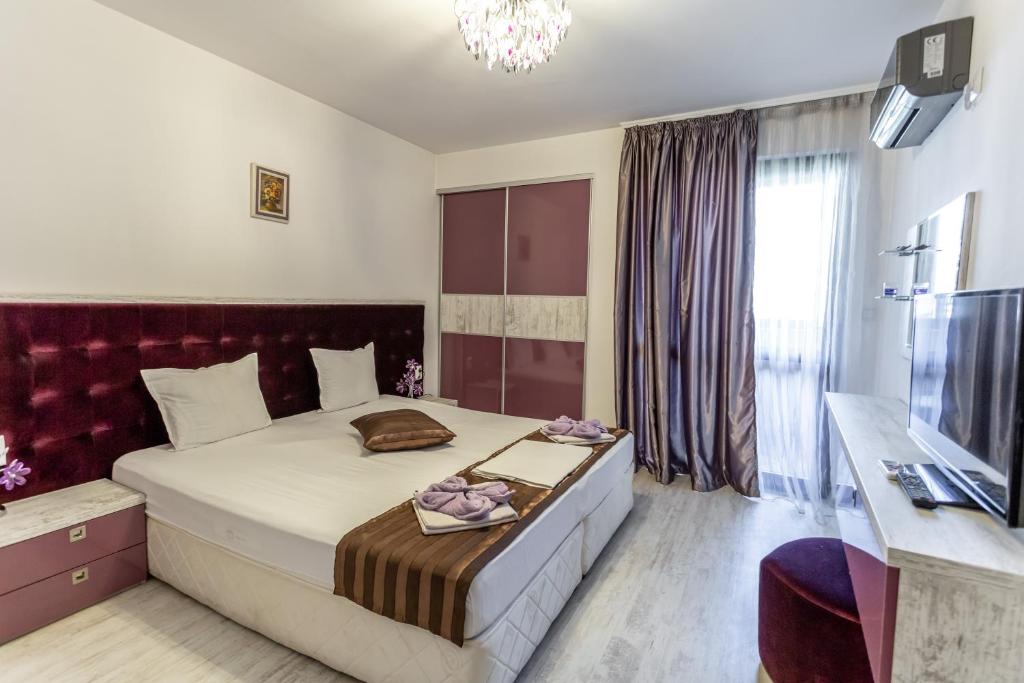 Postel nebo postele na pokoji v ubytování Lombardi Family Hotel