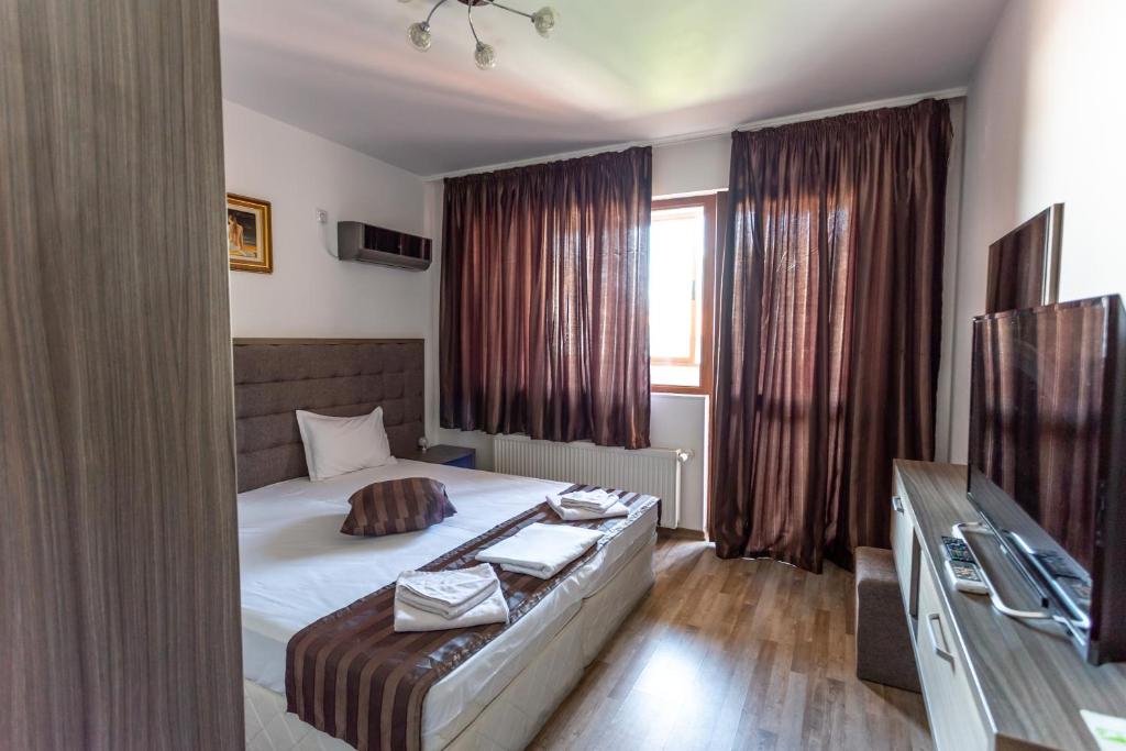 Postel nebo postele na pokoji v ubytování Lombardi Family Hotel
