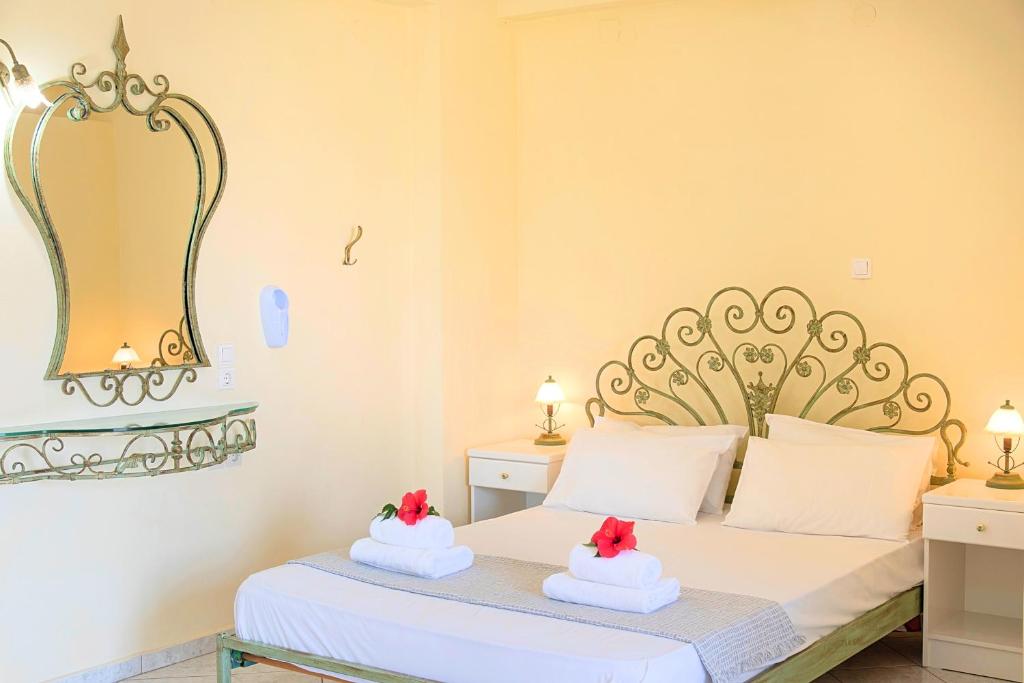 Postel nebo postele na pokoji v ubytování Palladion Hotel
