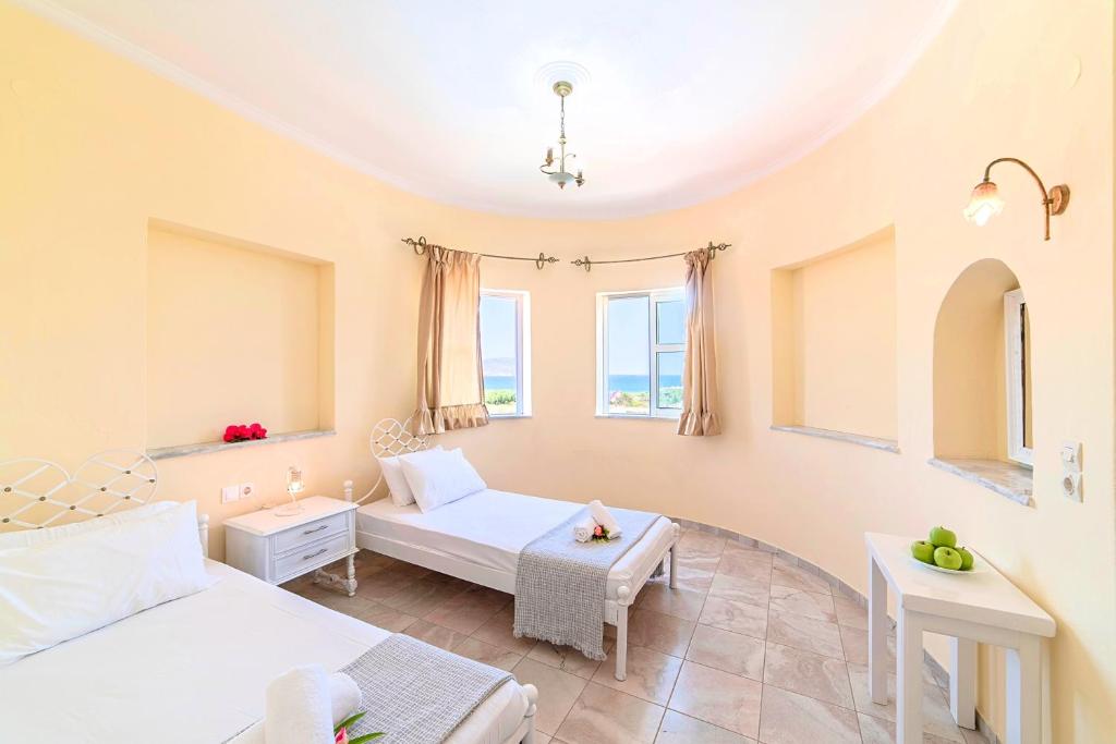 Postel nebo postele na pokoji v ubytování Palladion Hotel
