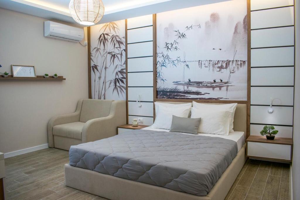 Un pat sau paturi într-o cameră la Apartments Stanaj