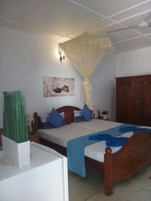 Postel nebo postele na pokoji v ubytování Embiente Guest House