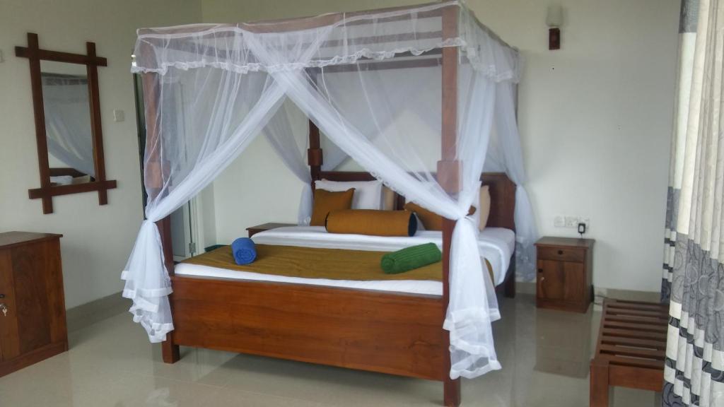 Postel nebo postele na pokoji v ubytování Senasuma Homestay