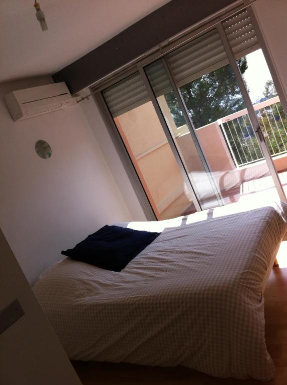 Ένα ή περισσότερα κρεβάτια σε δωμάτιο στο La Madonette