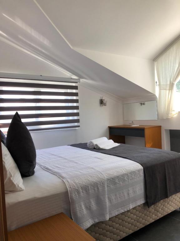 Postel nebo postele na pokoji v ubytování AdaHan Family Rooms Gocek