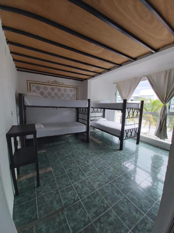 Postel nebo postele na pokoji v ubytování Emotion Avenida Tulum Hotel & Hostal