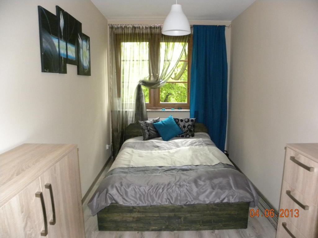 Posteľ alebo postele v izbe v ubytovaní Apartament U Anny
