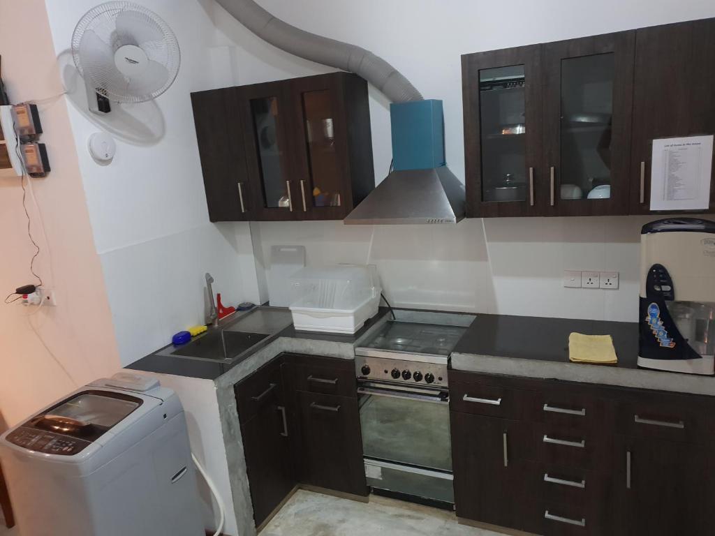 Kuchyň nebo kuchyňský kout v ubytování Trellis Homes