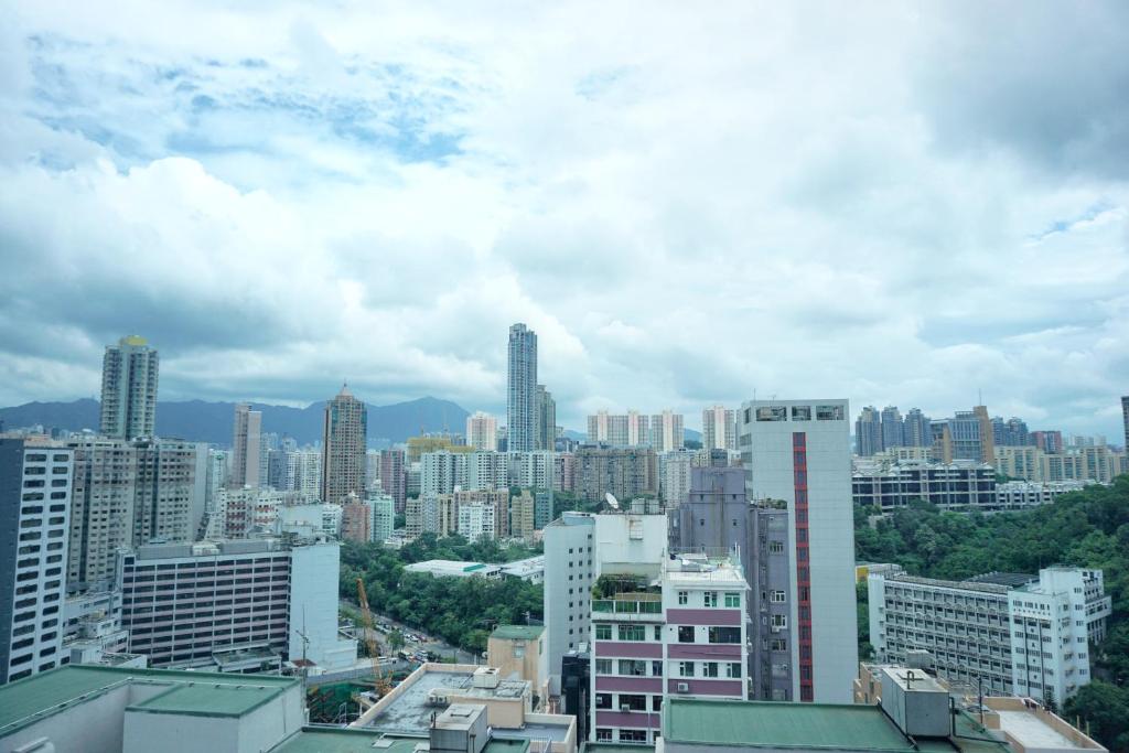 a view of a city with tall buildings at Hotel Ease Mong Kok in Hong Kong