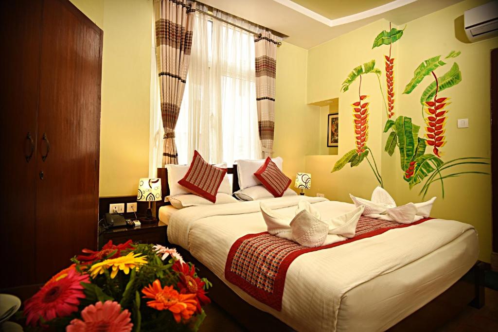 Postel nebo postele na pokoji v ubytování Hotel Osho Home