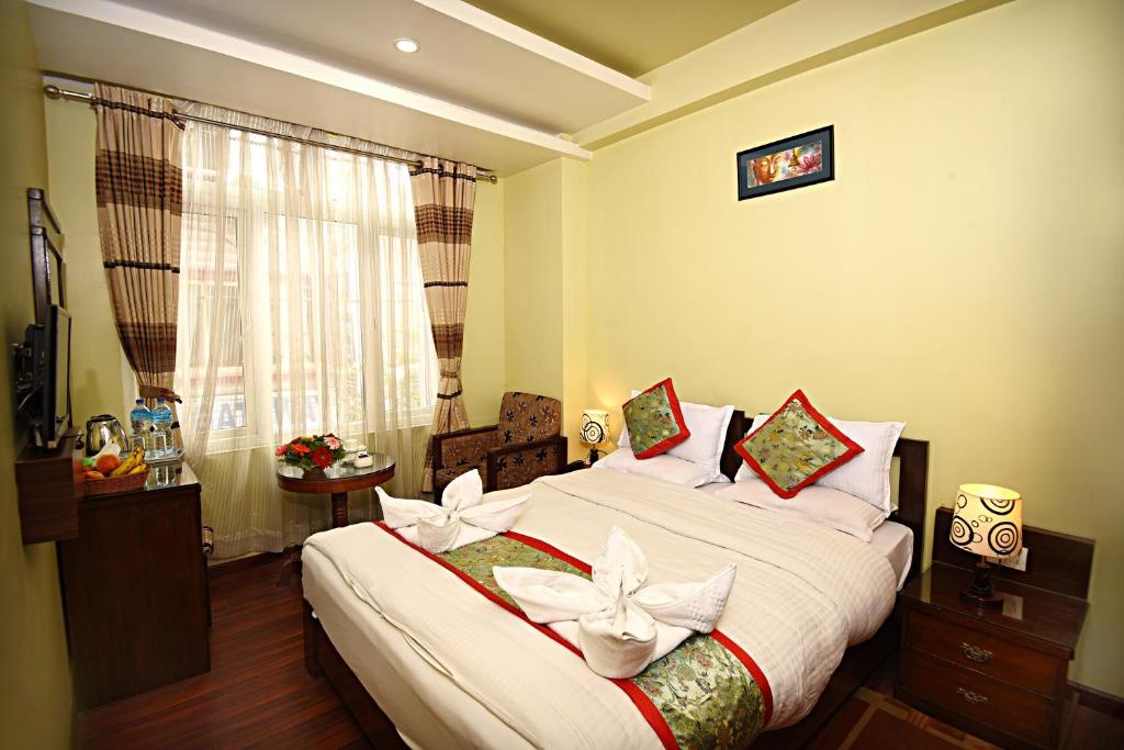 Postel nebo postele na pokoji v ubytování Hotel Osho Home