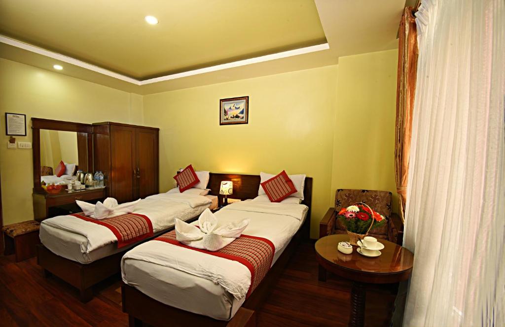 Postel nebo postele na pokoji v ubytování Hotel Osho Home