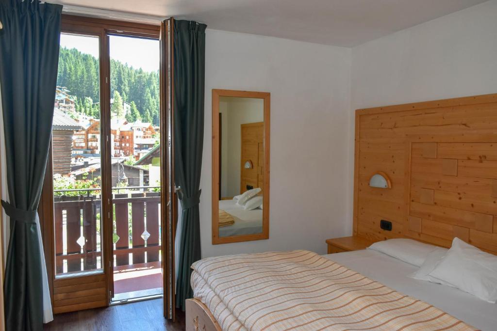 Łóżko lub łóżka w pokoju w obiekcie Hotel Europa