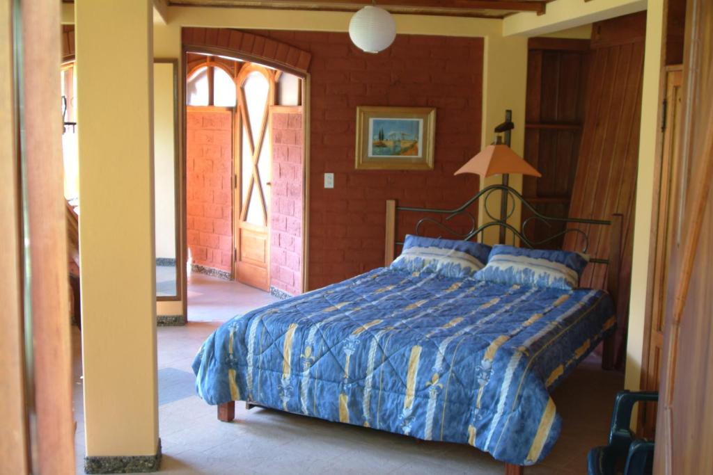 Postel nebo postele na pokoji v ubytování Finca Chamanapamba Guest House
