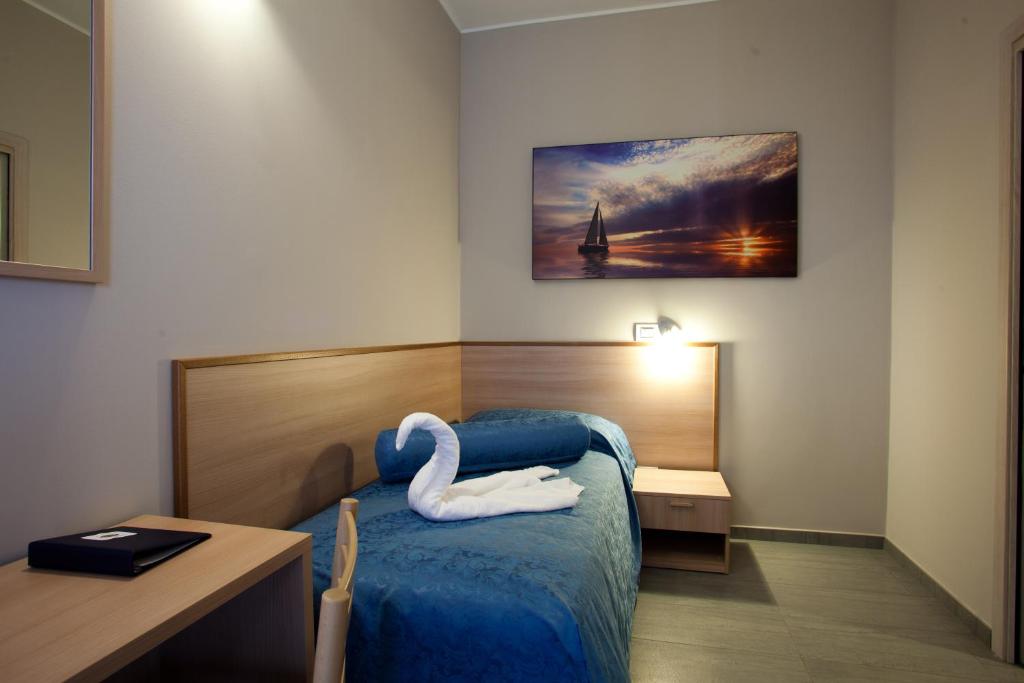 Postel nebo postele na pokoji v ubytování Motel Karibe