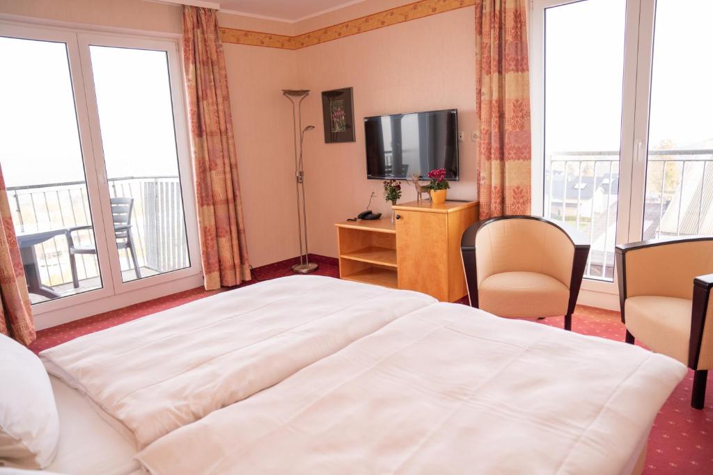 Postel nebo postele na pokoji v ubytování Hotel Löwenstein