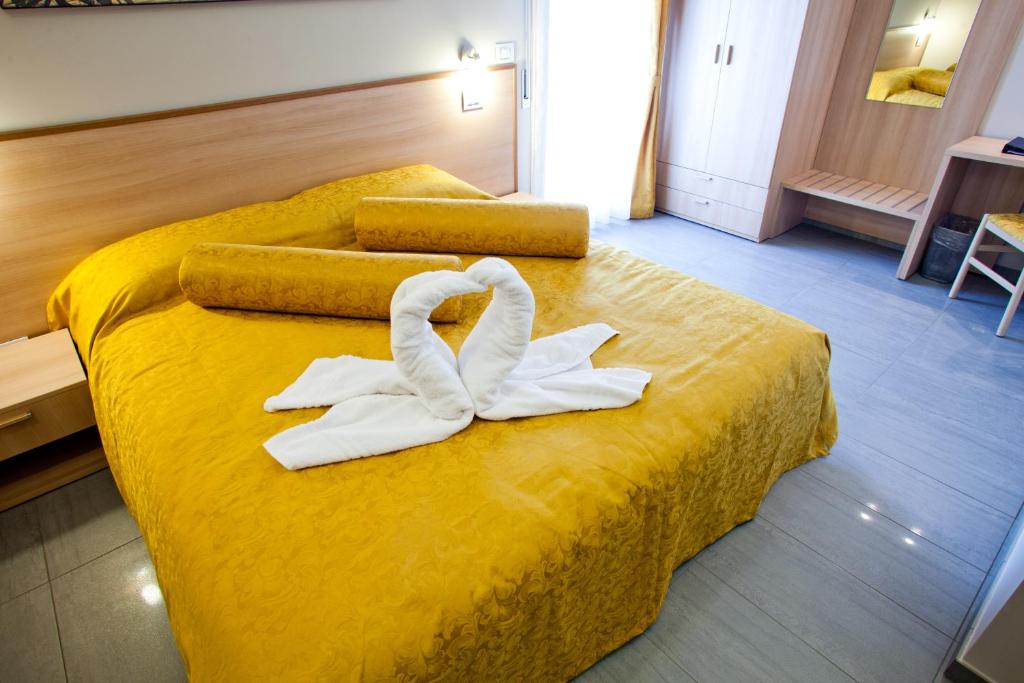 Postel nebo postele na pokoji v ubytování Motel Karibe