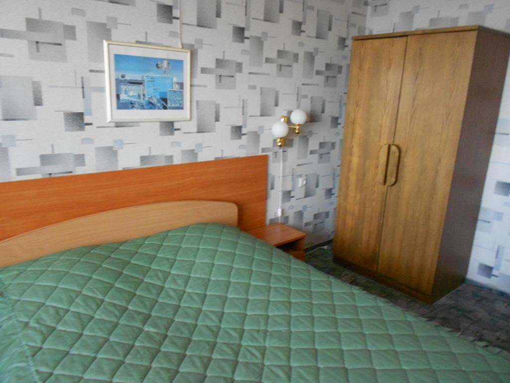 Postel nebo postele na pokoji v ubytování Jeruzale Hotel