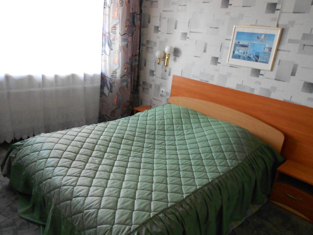Postel nebo postele na pokoji v ubytování Jeruzale Hotel
