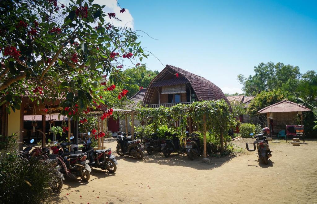 a group of motorcycles parked in front of a house at Harry's Ocean House Pacitan in Pacitan
