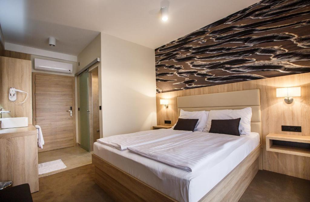 Postel nebo postele na pokoji v ubytování Luxury Suites Bellevue