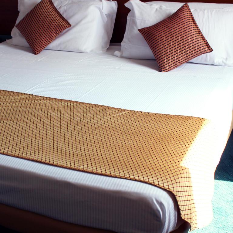 Postel nebo postele na pokoji v ubytování Hotel Filanda