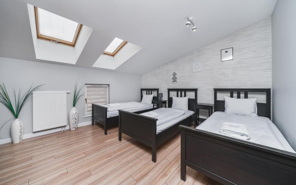 Posteľ alebo postele v izbe v ubytovaní Deluxe Apartments Kraków Brzozowa by Noclegi Renters