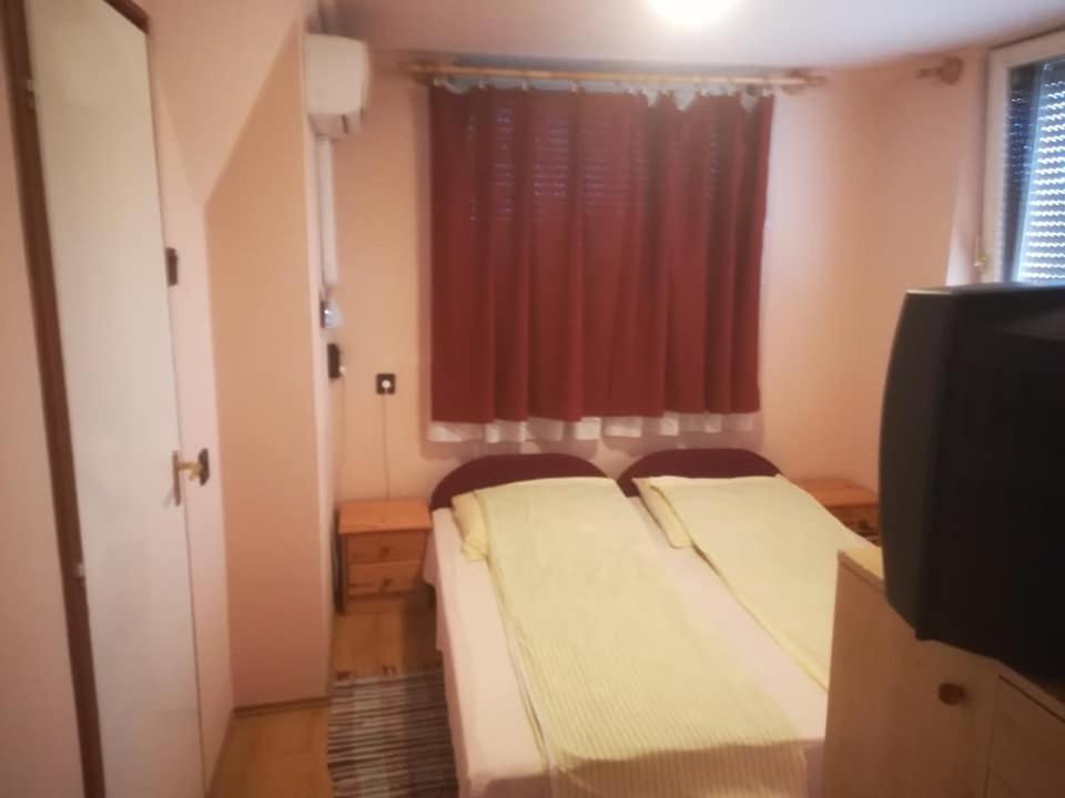 Posteľ alebo postele v izbe v ubytovaní Karika Vendégház