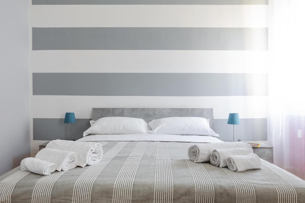 A bed or beds in a room at Sant'Orsola Colorful Huge Apartment