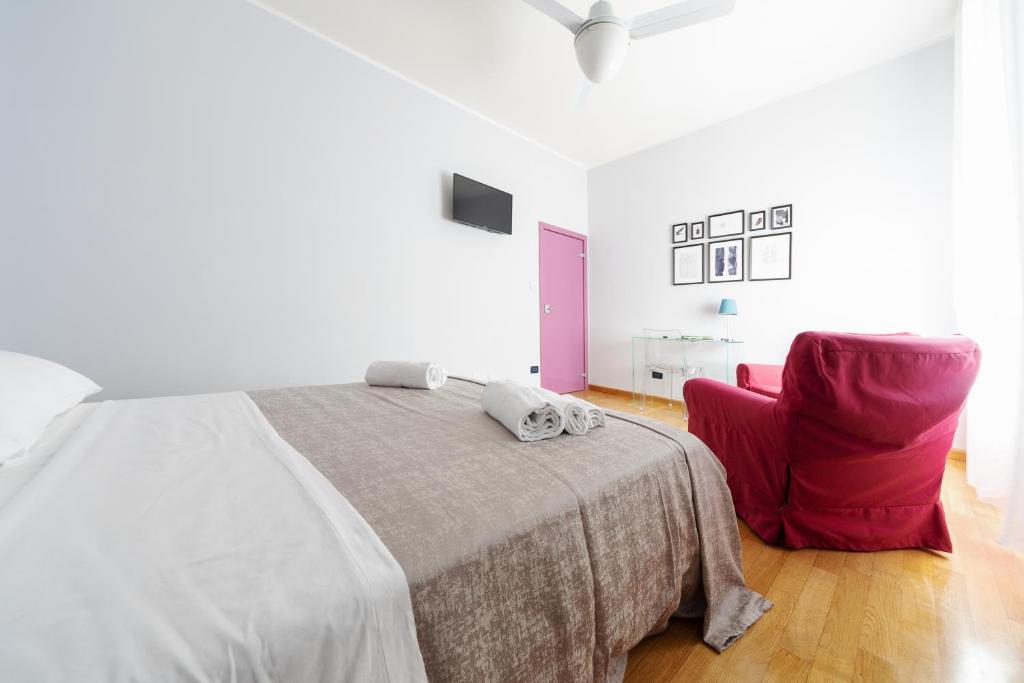 A bed or beds in a room at Sant'Orsola Colorful Huge Apartment