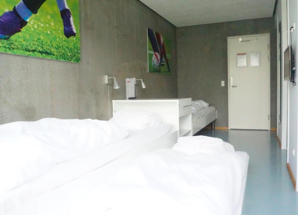 Postel nebo postele na pokoji v ubytování DBU Hotel & Kursuscenter