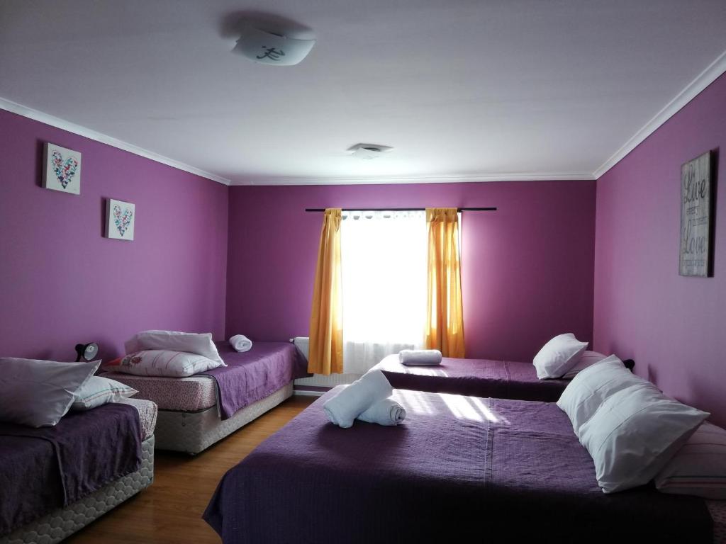Postel nebo postele na pokoji v ubytování Hostal La Base