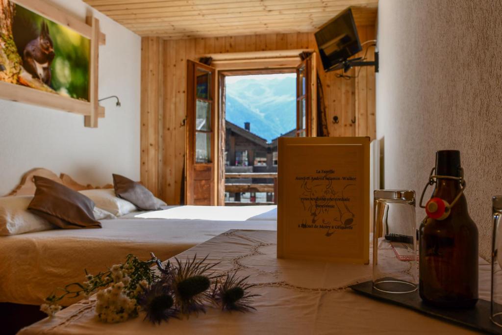 TV a/nebo společenská místnost v ubytování Hotel de Moiry Supérieur