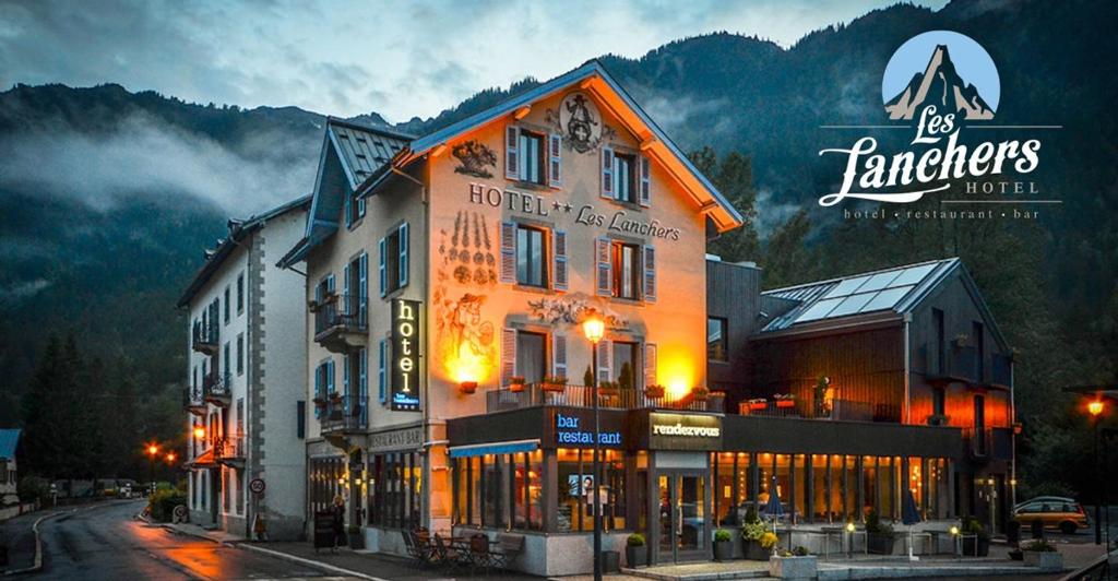 a large building on the side of a street at Hotel Les Lanchers in Chamonix